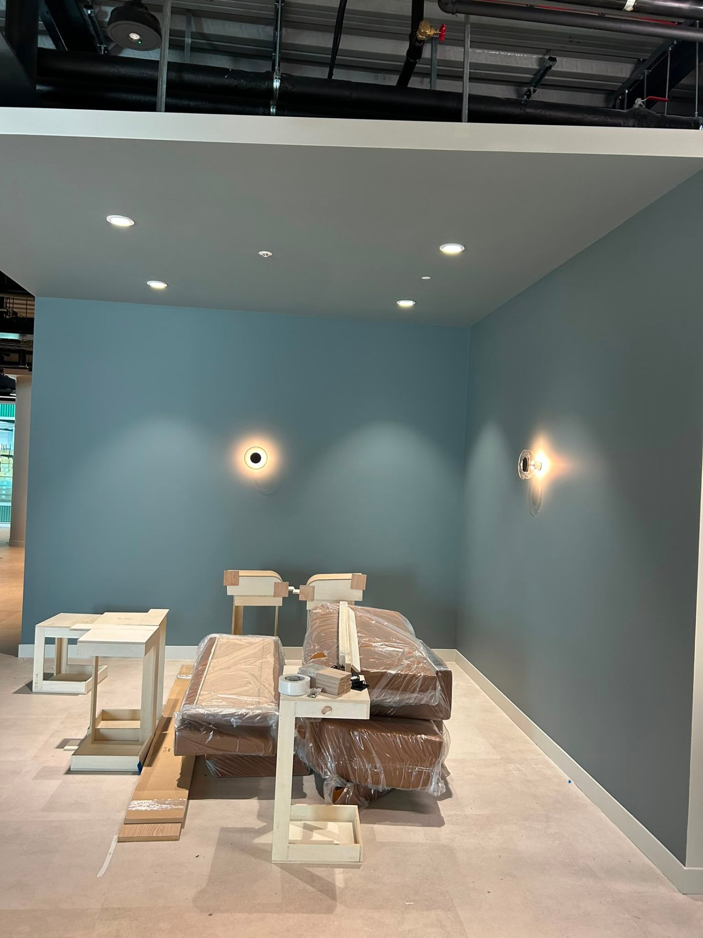 Painting services UK blue accent wall and lighting by MOVIR INTERIORS